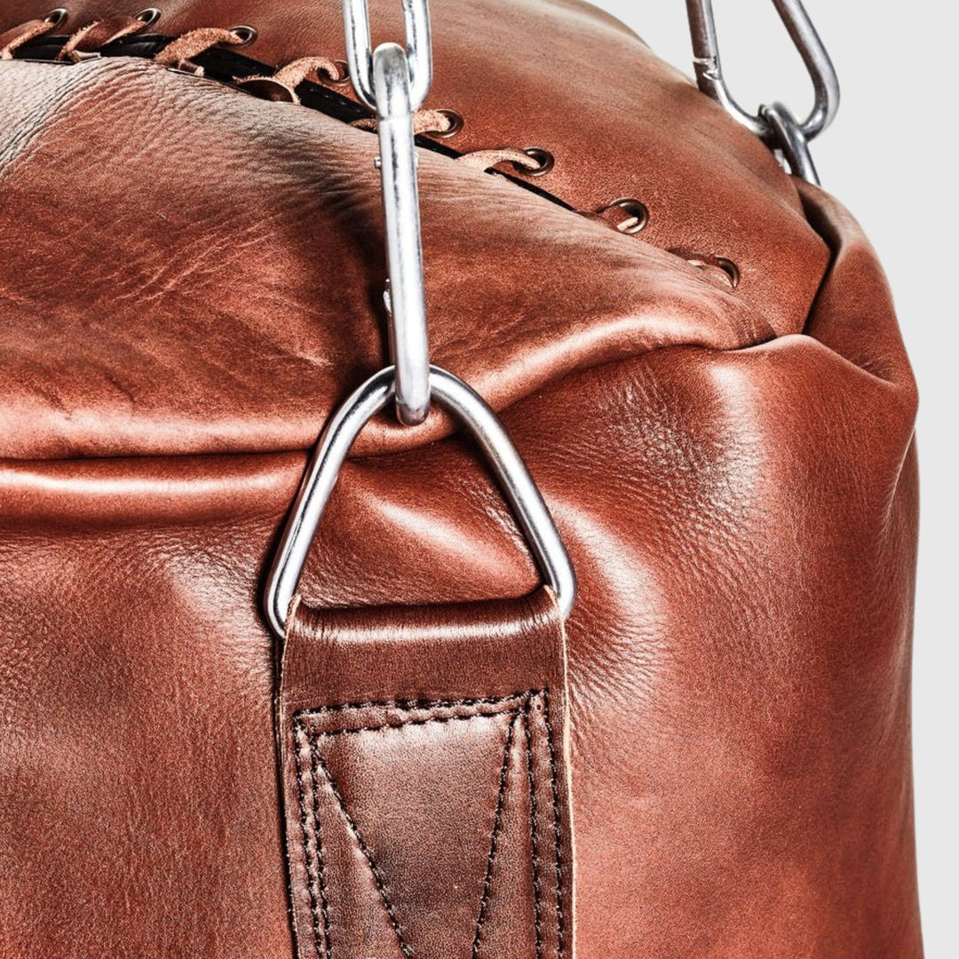 Heritage Brown leather heavy bag detail: hand-stitched cowhide and steel clip chain