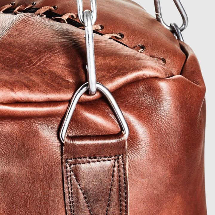 Heritage Brown leather heavy bag detail: hand-stitched cowhide and steel clip chain